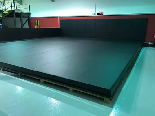 Black floor vinyl in a gym set up with equipment